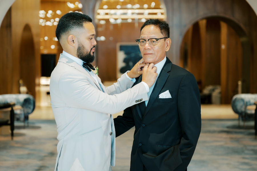 Groom fixes his father's tie right before the San Jose wedding ceremony