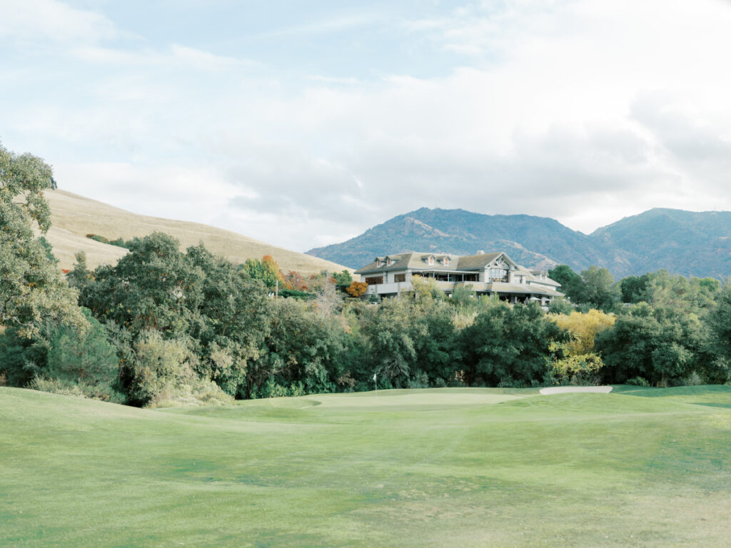 Distance view of mountains and Oakhurst country club amidst trees